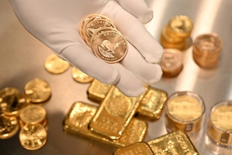 Gold bars and coins on a table