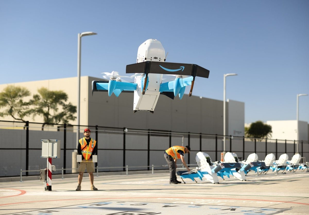 Amazon drone in flight over uk countryside