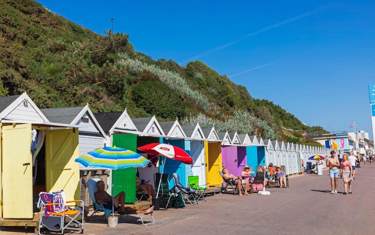 Beach huts with second homes tax sign