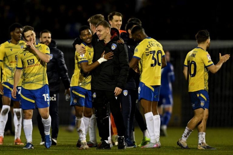 Colchester United players celebrating win